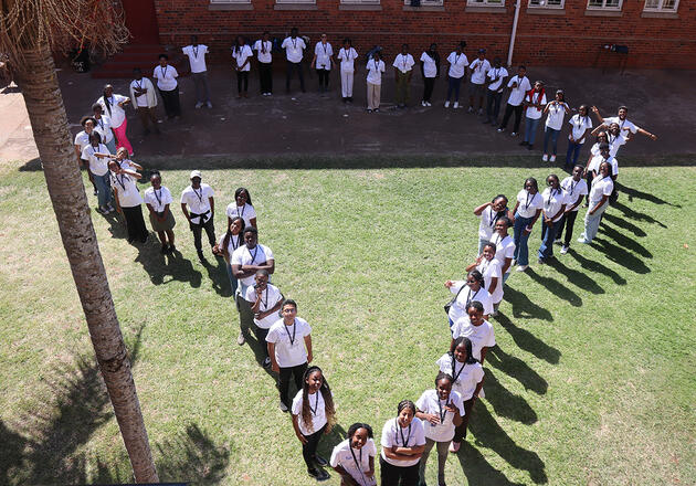 YYAS students standing in a formation depicting the outline of Africa
