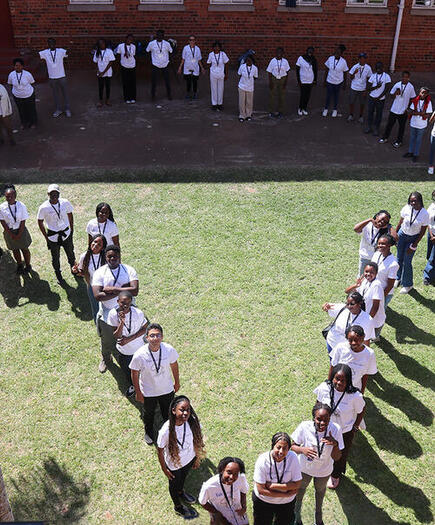 YYAS students standing in a formation depicting the outline of Africa.
